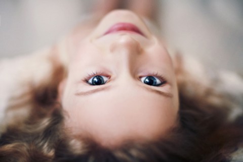 Caucasian teenage girl looking up