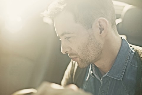 Caucasian man driving car