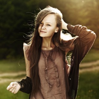 Caucasian woman smiling in field