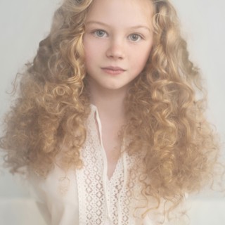 Caucasian teenage girl with curly hair