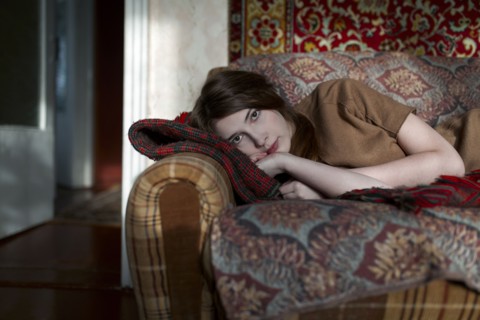 Caucasian woman laying on sofa