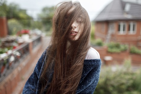 Wind blowing hair of Caucasian girl