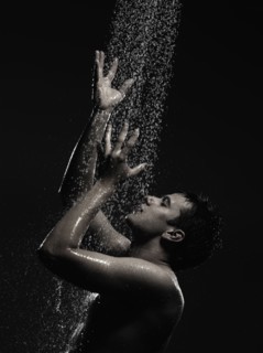 Caucasian man standing in shower