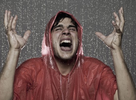 Caucasian man caught in the rain
