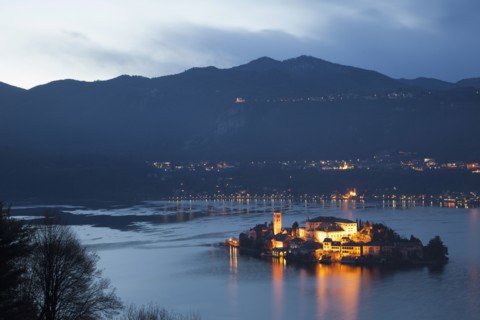 Illuminated island in Italian lake