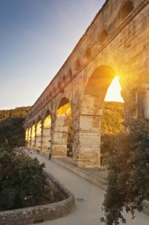 Sun shining through aqueduct