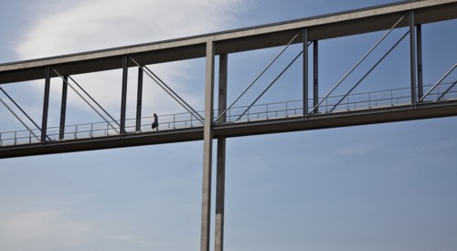 Woman walking on skybridge