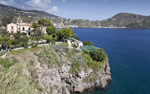 Building on cliff overlooking ocean