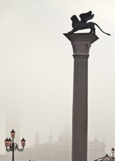 Silhouette of statue on pillar