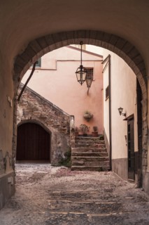 Stone archway to courtyard and steps
