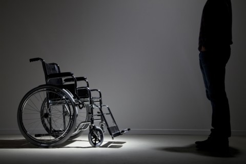 Caucasian man approaching wheelchair