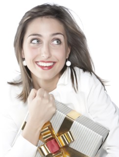 Smiling woman holding wrapped gift