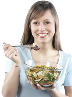 Hispanic woman eating salad