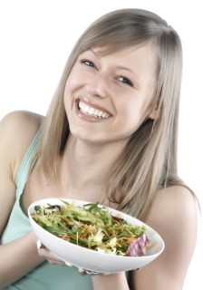 Hispanic woman eating salad
