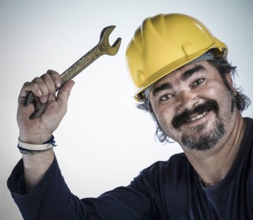 Construction worker holding wrench