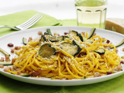 Close up of pasta with zucchini and cheese