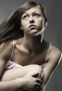 Wind blowing long hair of Caucasian woman