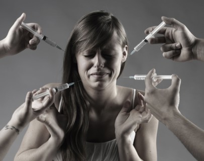 Caucasian woman fearing syringes