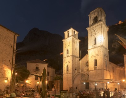 People at outdoor restaurant at night
