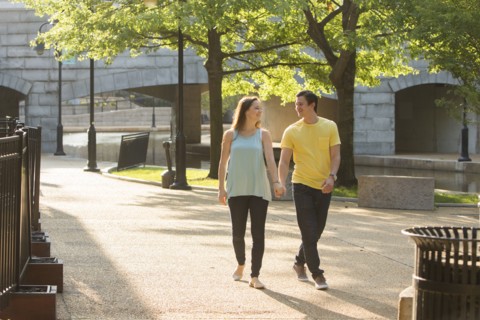 Caucasian couple walking in park