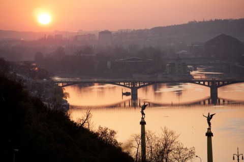 Sunset on bridge over river
