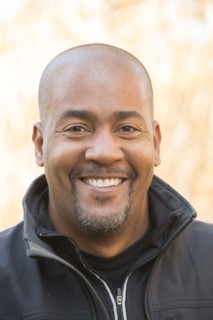 Close up of smiling Mixed Race man