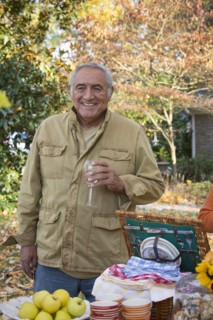 Hispanic man drinking wine outdoors