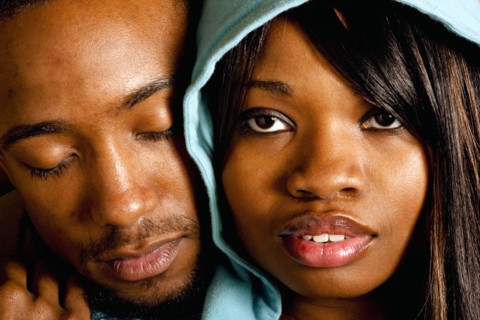 African couple hugging