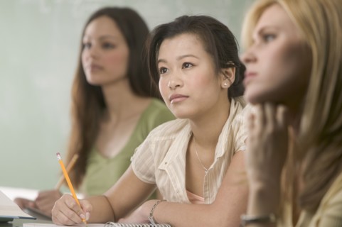 Women taking notes in class