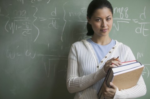 Portrait of female student holding books