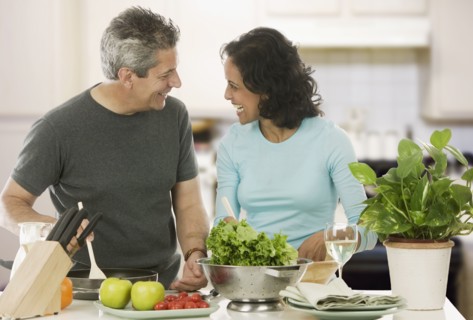 Couple cooking in kitchen