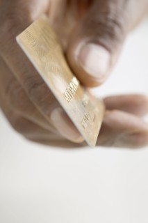 Close up of hand holding credit card