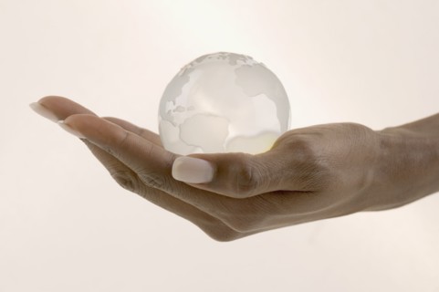 Close up of hand holding globe