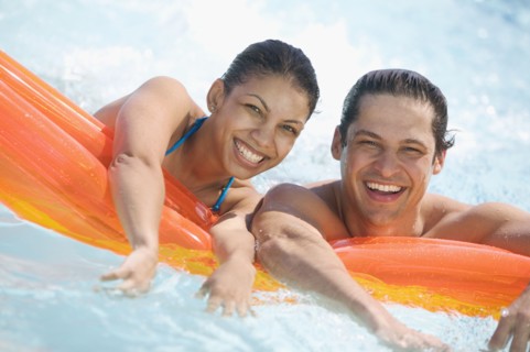 Portrait of couple in swimming pool