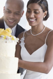 Bride and groom cutting cake