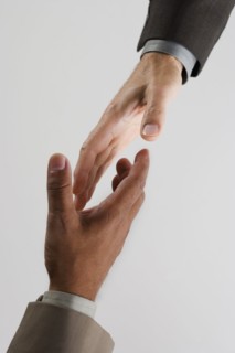 High angle view of businessman's hands shaking