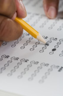 Close up of hands filling in form