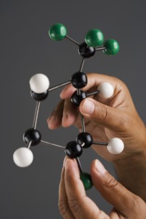 Close up of hands holding model