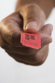 Close up of hand holding ticket