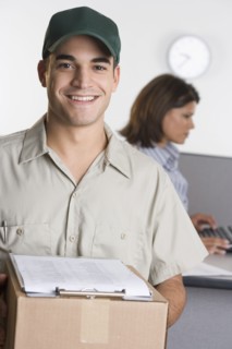 Portrait of delivery man with box