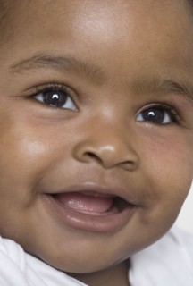 Close up of baby's smiling face