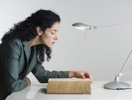 Woman reading thick book
