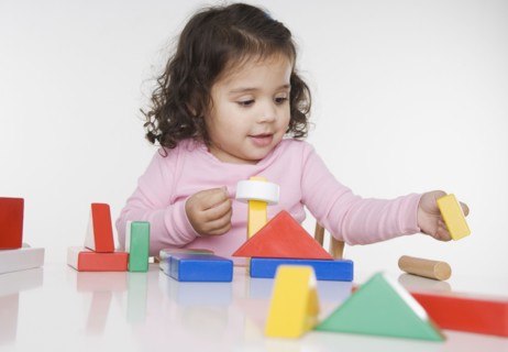 Little girl playing with blocks