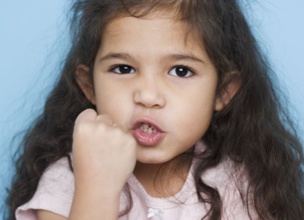 Portrait of girl making fist