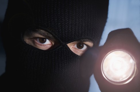 Thief shining his flashlight