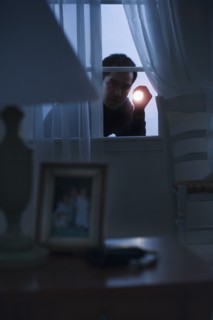 Thief peering in a window
