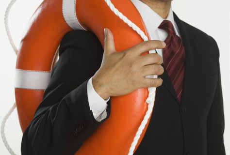 Close up of businessman holding life preserver