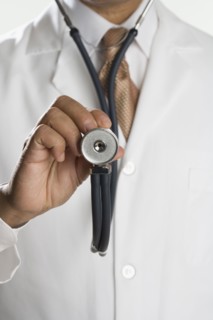 Close up of male doctor's hand holding stethoscope