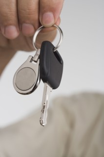 Close up of man's hand holding car key