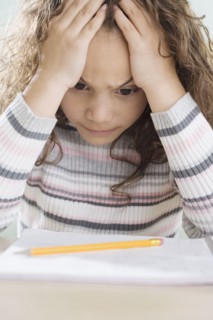 Young girl thinking about homework